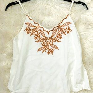 White sleeveless top